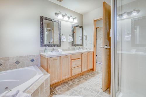 a bathroom with a tub and a sink and a shower at Icicle Village Resort 507 & 508: Alpine Reflections in Leavenworth