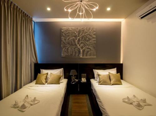 מיטה או מיטות בחדר ב-Hotel De Palace