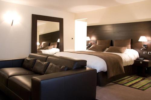 Postel nebo postele na pokoji v ubytování Hotel Palladia