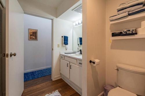 a bathroom with a toilet and a sink at Kailua Bay Resort 4-303 in Kailua-Kona