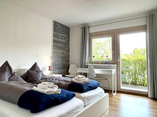 a bedroom with two beds with towels on them at Ferienwohnung Im Vogelsang in Sigmarszell