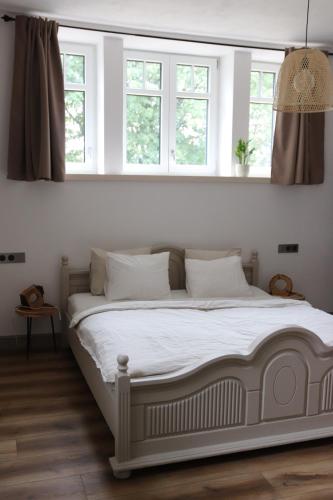 Postel nebo postele na pokoji v ubytování Apartmán MEZI DUBY