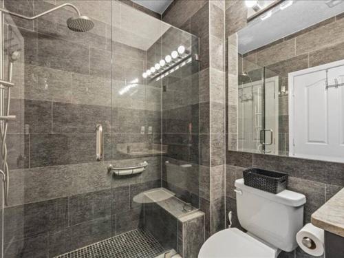 a bathroom with a toilet and a shower at Theme Park Paradise! in Kissimmee