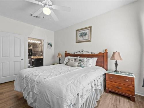 a bedroom with a large bed and a ceiling fan at Theme Park Paradise! in Kissimmee