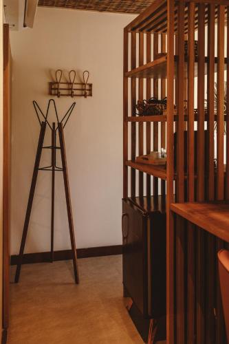 a room with a ladder and a shelf with scissors at Pousada Moana in Fernando de Noronha