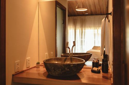 a bathroom with a large bowl sink on a counter at Pousada Moana in Fernando de Noronha