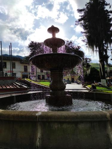 a fountain with purple lights on top of it at LA MARQUESA PACORA in Pácora