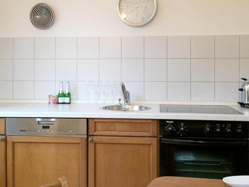 a kitchen with a sink and a stove at Ferienhaus Köchlin in Lindau