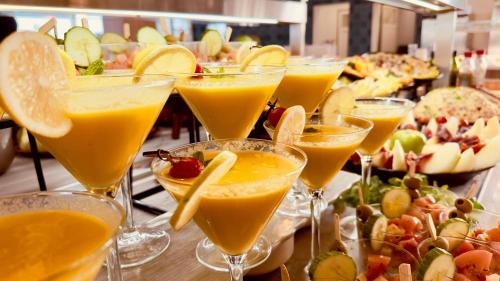 a bunch of glasses filled with orange juice at Caleta Dorada in Caleta De Fuste