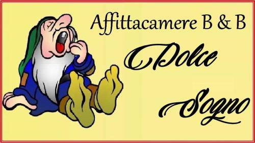 a cartoon of a woman jumping in the air and a comic sign at AFFITTACAMERE DOLCE SOGNO in Cherasco