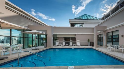 a swimming pool in the backyard of a house at Southern Sun Sandton in Johannesburg