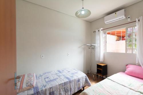 Ένα ή περισσότερα κρεβάτια σε δωμάτιο στο Hostel toca do Noel e Bia