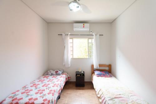 Ένα ή περισσότερα κρεβάτια σε δωμάτιο στο Hostel toca do Noel e Bia