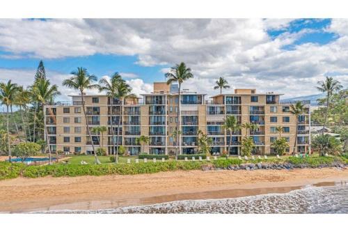 a view of the hotel from the beach at KIHEI BEACH, #506^ condo in Kihei