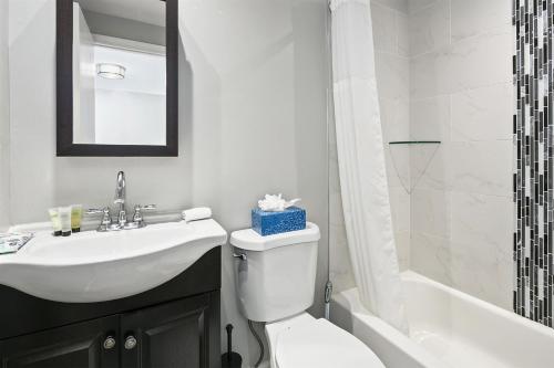 a bathroom with a sink and a toilet and a shower at Townhome in No VA, 40 Mins to DC, Pets OK, Fast WiFi in Sterling