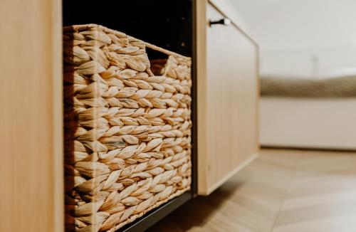 a door of an oven with a basket in it at Old brick boutique apartments in Klaipėda