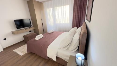 Ένα ή περισσότερα κρεβάτια σε δωμάτιο στο Kula apartman - Novi Pazar