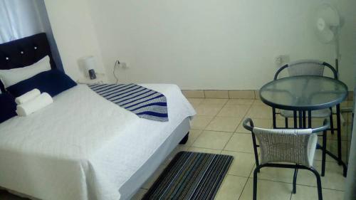 Een bed of bedden in een kamer bij Mosas Home