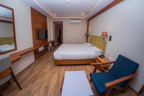 Postel nebo postele na pokoji v ubytování Hotel Fewa Trip