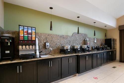 a kitchen with a counter with pots and pans at Antioch Hotel & Suites in Antioch