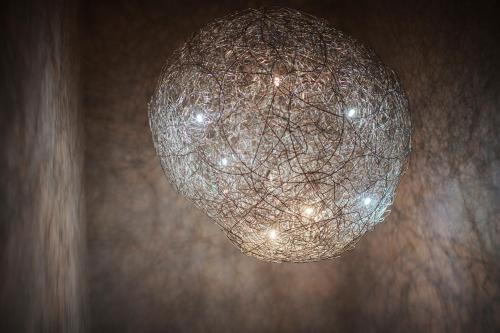 a close up of a chandelier hanging from a wall at Hotel Lindenhof in Erkelenz