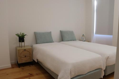 En eller flere senge i et værelse på A Casa da Joana