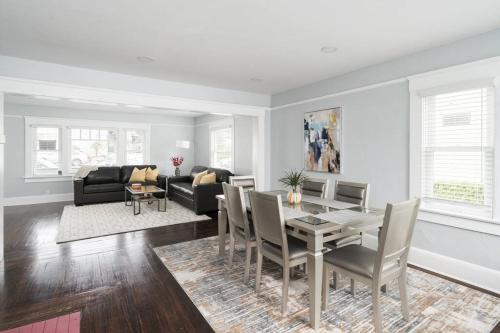 a living room with a dining table and a couch at Bankers Hill Chic Roomy Home Near Airport in San Diego