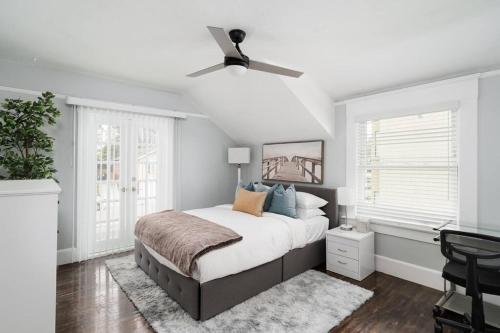 a bedroom with a bed and a ceiling fan at Bankers Hill Chic Roomy Home Near Airport in San Diego