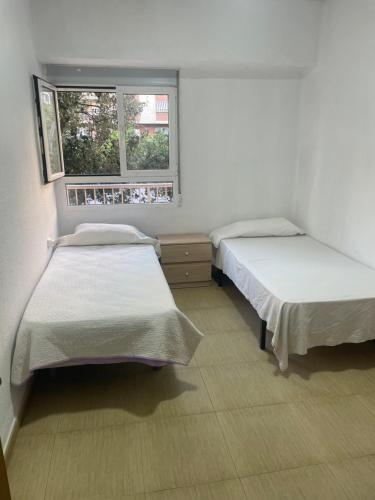 Habitación privada tesisinde bir odada yatak veya yataklar