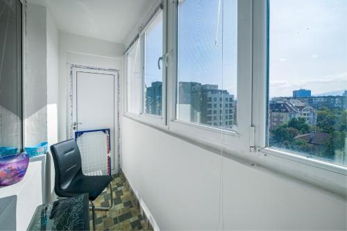 an empty room with a chair and a window at Nova #7 in Sofia