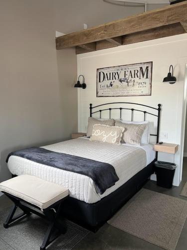 a bedroom with a large bed and a sign on the wall at Silo Suite 1 Pet Friendly- Near Zion National Park in La Verkin