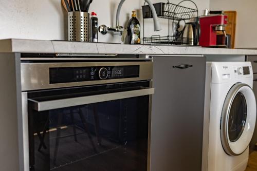 a kitchen with a stove and a dishwasher at Nova #7 in Sofia