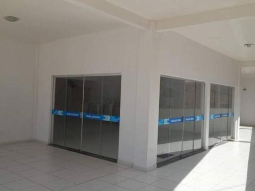 a row of lockers in a building with blue lines at Apart. 2/4 - 500 mts da praia.Ilhéus in Ilhéus