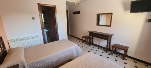 Postel nebo postele na pokoji v ubytování Hostal El Molino
