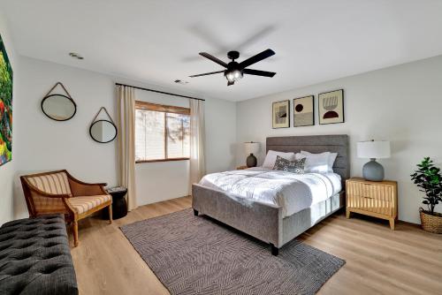 a bedroom with a bed and a ceiling fan at Three Bedroom, Amazing Views, Hot Tub and Pets Allowed, Close to Chapel of the Holy Cross and Chapel Hill, less than 1mi to Trailheads in Sedona