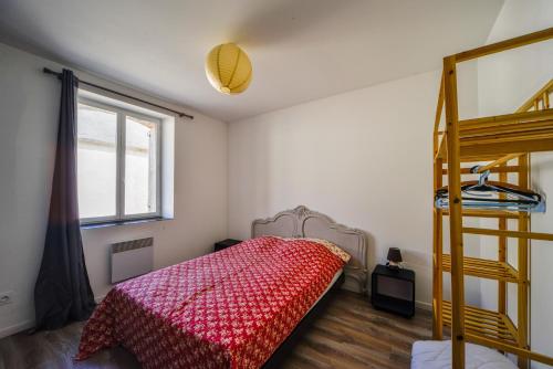 a bedroom with a bunk bed and a ladder at Grand Gîte de Villecomte in Sainte-Solange