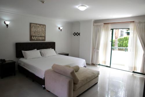 Postel nebo postele na pokoji v ubytování Hotel Palmera Real