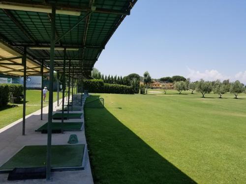 a row of benches in a large grass field at Indipendent Studio Apartment with Terrace - Parking in Florence