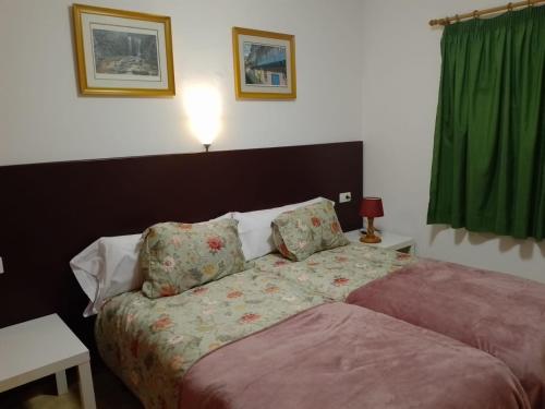מיטה או מיטות בחדר ב-Casa Lago Azul 49