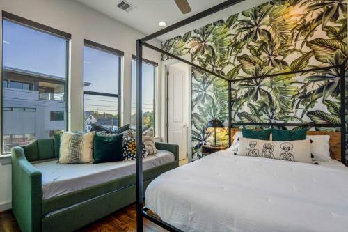 a bedroom with a bed and a wall of windows at Urban Jungle Retreat in the HTX Skyline in Houston