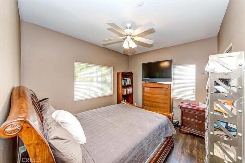 a bedroom with a bed and a ceiling fan at Shared Luxury Beach house in Redondo Beach. Private 2 Bedrooms / Bath in Redondo Beach