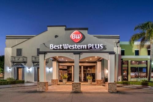 a store with a sign that reads best western plus at Best Western Plus Westbank in Harvey