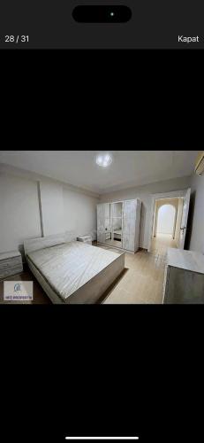 a bedroom with a large bed in a room at Murat Baris Residence in Alanya