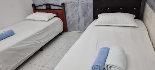 My Homestay Tronoh Seri Iskandar tesisinde bir odada yatak veya yataklar