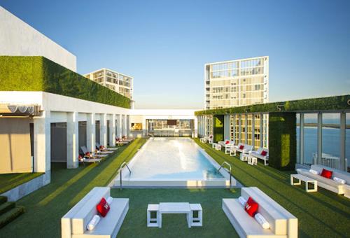 a rendering of a building with a swimming pool at Luxurious Condo at ICON with Views in Miami