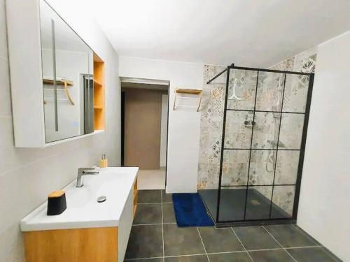 a bathroom with a sink and a shower at Appartement cosy in Fort-de-France