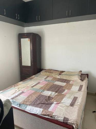 a bedroom with a bed in a room at Ranga Vila’s on ECR in Chennai