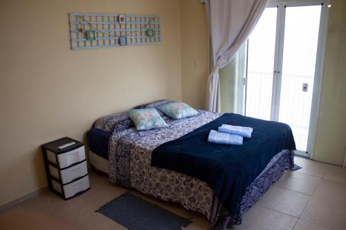 Katil atau katil-katil dalam bilik di Casa do Farol - Frente para a praia