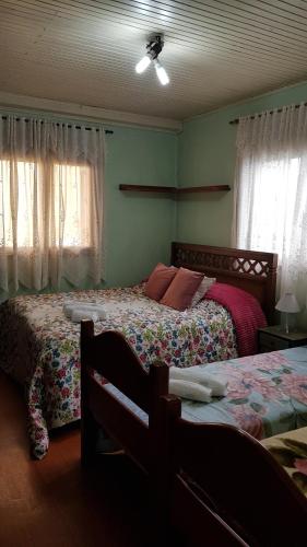 Ένα ή περισσότερα κρεβάτια σε δωμάτιο στο Charmoso apartamento da Vovó Enedina