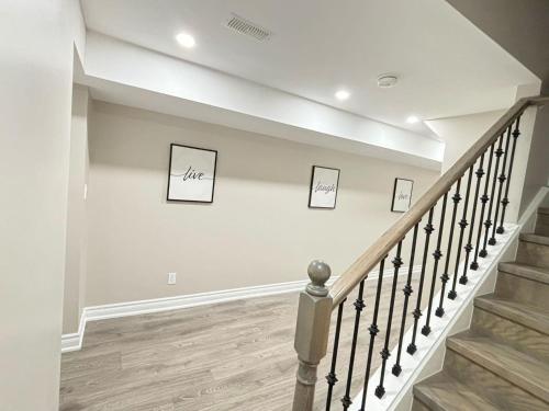 a staircase with three pictures on the wall at Cozy 1.5 Guest-Suite in Aurora
